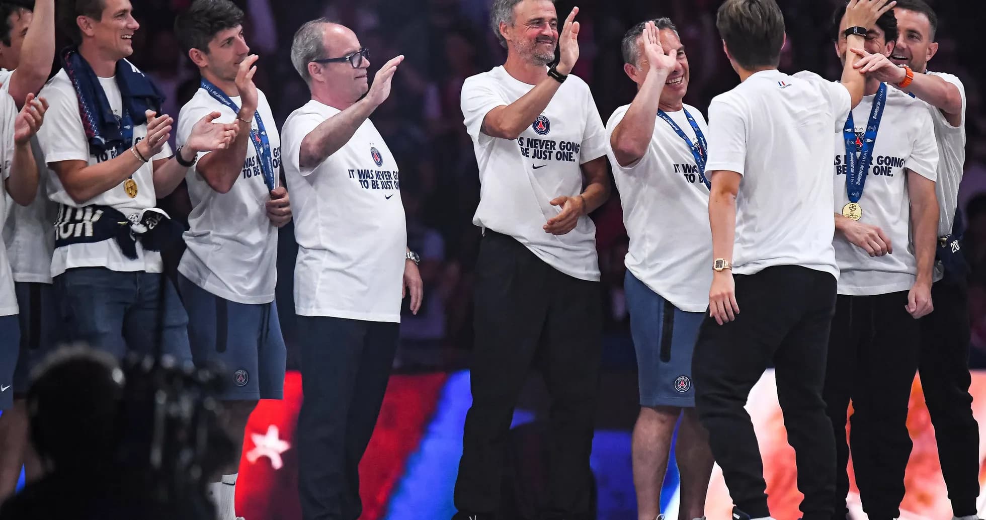 Celebration with team members wearing matching shirts