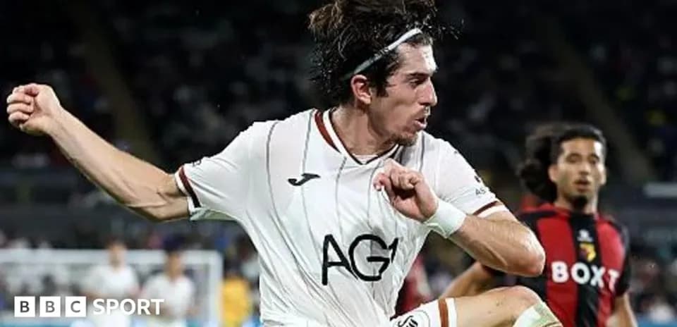 Jugador de fútbol saltando durante el partido