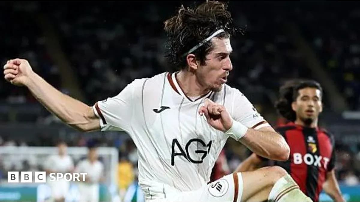 Jugador de fútbol saltando durante el partido