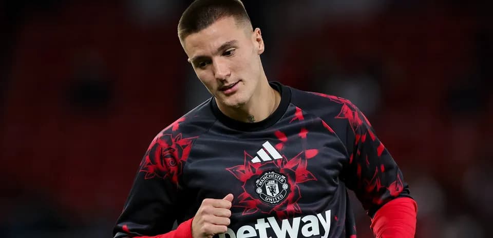 Jugador de Manchester United calentando antes del partido
