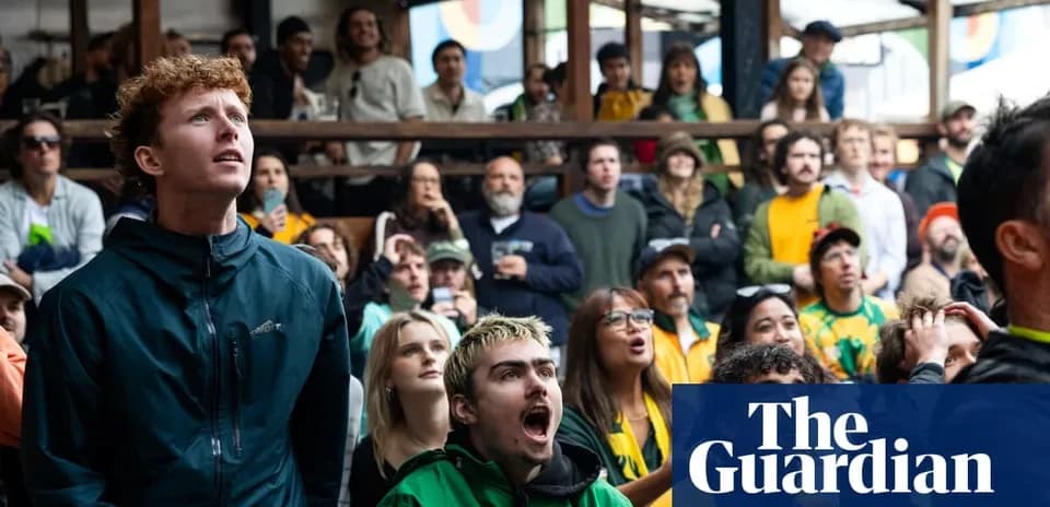 A group of fans watching a sports event
