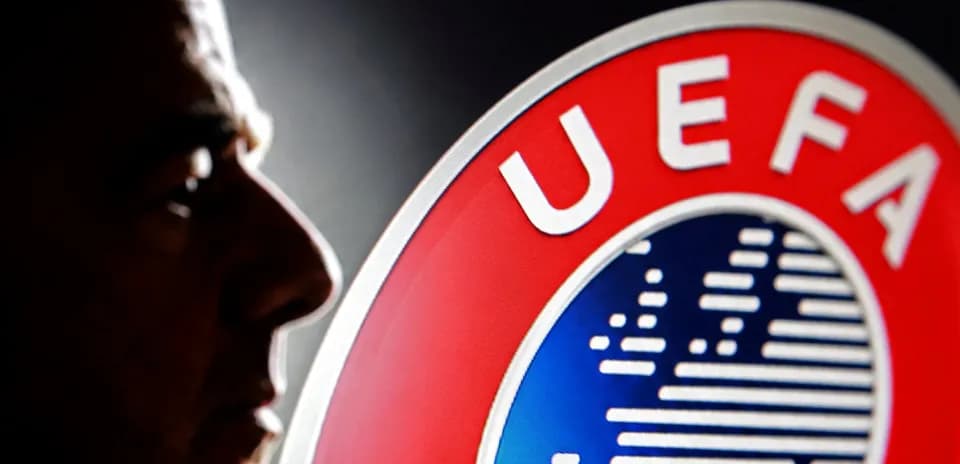 Silhouette de una persona junto al logo de UEFA