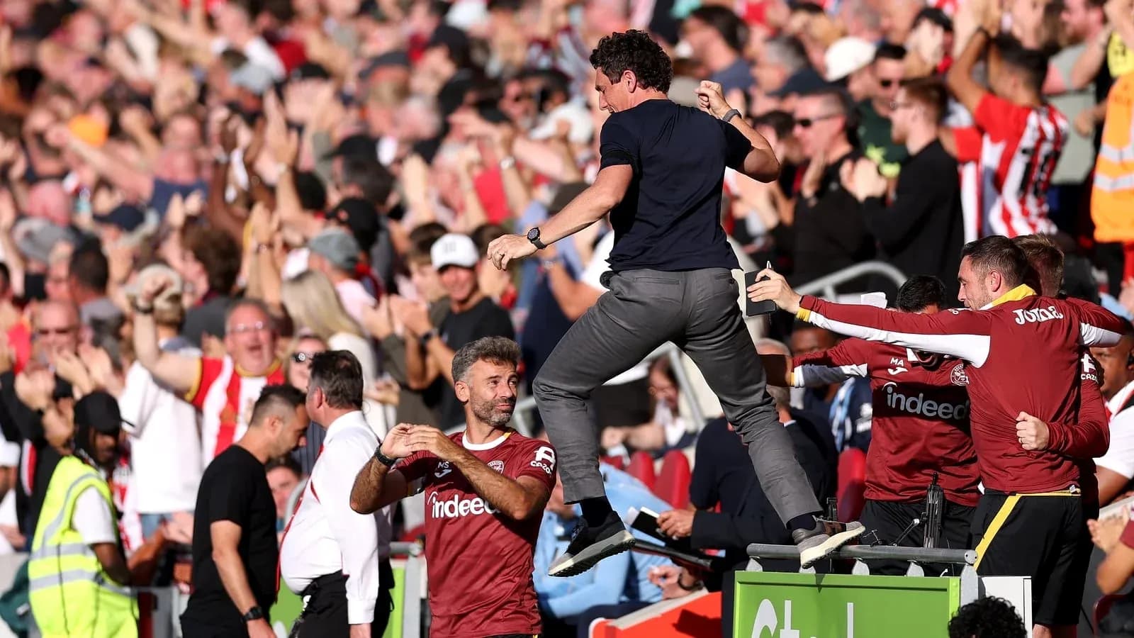 Celebration of players and fans during match
