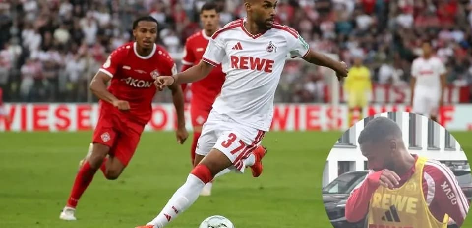 Jugador de FC Köln corriendo con el balón durante el partido