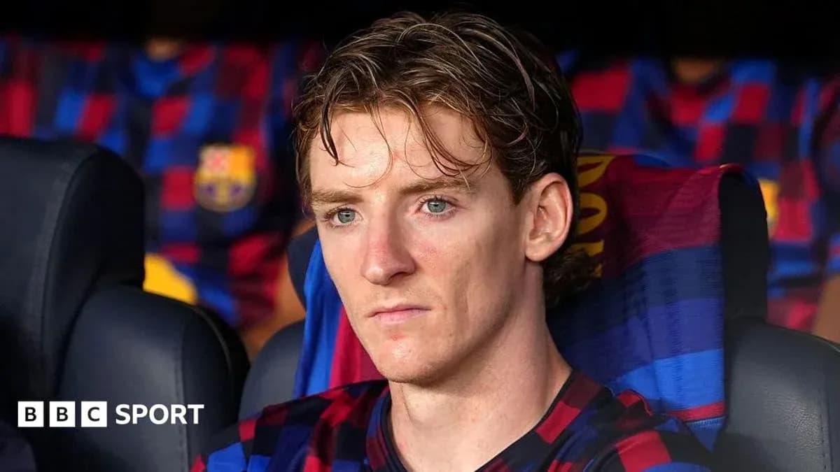 Jugador sentado en el banquillo del FC Barcelona Jugador sentado en el banquillo del FC Barcelona